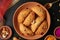 Popular Holi Snack known as Karanji or Gujia is Served on earthen platter. (Holi Concept