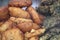 Popular hot Indian snacks called `Alu Besan Chop` & `Dhaniya Patta Pakora` inside a display glass and creating vapor on glass wall