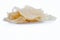 Popular Indian and Asian crispy snack dish i.e. Raw uncooked Papad or rice flour papadum in  a hamper isolated on white.