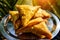 Popular Indian street food. Vegetarian samosa with potatoes, onions, beans and masala. Triangular pie, fried in oil, close-up