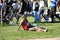 Popular marathon runner resting on grass