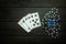 Popular poker game with straight flush winning combination. Cards with chips on a black vintage table in a poker club. Free black