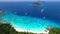 Popular Princess Beach and Blue Clear Water with Boats and Small Islands. Aerial HD Slowmotion. Similan, Thailand.