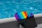 Popular silicone colorful anti stress pop it toy on edge of frame swimming pool. Simple dimple. Trendy Pop it Fidget toy