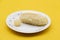Popular Sweet Rasgulla Also Know as Rosogolla, Roshogolla, Rasagola isolate on yellow background