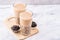 Popular Taiwan drink - Bubble milk tea with tapioca pearl ball in drinking glass on marble white table wooden tray background,