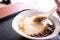 Popular Taiwan gourmet - Dessert of tapioca pearl ball bubble mixed bean curd tofu pudding douhua, dou hua in white bowl,