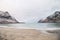 Popular tourist beach Ersfjord on Senja Island in northern Norway above the Arctic Circle. A sandy beach surrounded by snow-capped