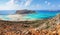 Popular touristic resort, coast of island Crete, Greece. Marvelous landscape of a rocky hill, Balos beach with fantastic sand.