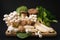 Popular uncooked healthy asian edible mushrooms Buna Shimeji,King Oyster mushrooms and Baby Bok Choy on black background