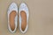 Popular white floral lace ballet flat slip on shoes on brown bac