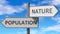 Population and nature as a choice - pictured as words Population, nature on road signs to show that when a person makes decision