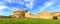 Populonia medieval village landmark, city walls and tower. Tuscany, Italy.