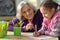 Porait of grandmother and granddaughter drawing together