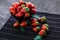 Porcelain bowl with mellow strawberries on table cover