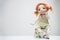 Porcelain clay young smiling redhead girl