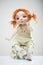 Porcelain clay young smiling redhead girl