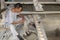 Porcelain Craftsman working in the Pottery workshop in Jingdezhen, China