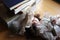 Porcelain doll lying near the books on the table