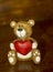 Porcelain fidurins little bear holding a heart