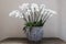 Porcelain flowerbed in gzhel style with white orchid flowers