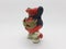 Porcellain Statue Of Masked Mouse Holding Magical Wand In White Isolation Back Ground 03