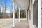 Porch of a contemporary and modern ranch-style house in the countryside with brown decking board