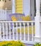 Porch Decor With Lavender Swing and Yellow Pillows