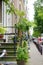 Porch of a house decorated with flowers and green plants in a typical Amsterdam street, Holland, Netherlands