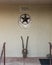 Porch with a Texas star and antique shear in Marfa, Texas.