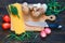 porcini, spaghetti, arrows of garlic, tomatoes, zucchini, parsley and knife on dark wooden background. Rustick stile. Food