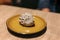 Porcupine shaped black bean bao. Served in yellow ceramic plate