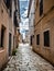 POREC, CROATIA - 6/20/2020: Empty street with biker during covid-19 isolation