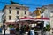 Porec Parenzo, Croatia; 7/19/2019: Typical square with terraces of bars with red umbrellas in the picturesque old town of Porec