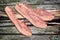 Pork Bacon Rasher on Old Cracked Wooden Picnic Table