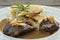 Pork cheeks in gravy with caramelized leeks and welsh onion cake