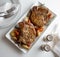 Pork chop dinner for two with vegetables on white platter