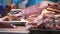 Pork cutting, meat shop, pork tenderloin, pieces of meat moving on conveyor belt, fresh meat