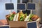 Pork, duck and chicken burgers placed in row in a cardboard box on a restaurant counter