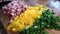 Pork ham being chopped next to green onion and yellow paper