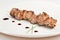 Pork kebab on white plate