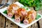 Pork meatballs - baked cutlet with minced meat and rice in crispy chicken skin shaped funny pigs