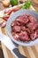 Pork medallions for Vietnamese dish preparation on a wooden board