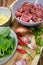 Pork medallions for Vietnamese dish preparation on a wooden board