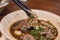 Pork noodle soup with meat ball served with bean sprout and holy