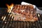 Pork Ribs Chop On The Hot Flaming BBQ Grill Close-up