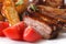 Pork ribs, potatoes and fresh tomatoes macro. Horizontal