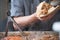 Pork sandwich being prepared over hot griddle