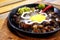 Pork sisig on a sizzling plate