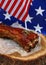 Pork spare ribs in bbq sauce over American flag